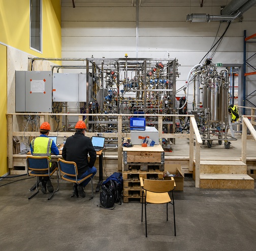 Two people working