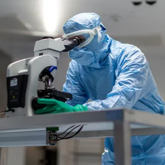A person looks into laboratory equipment
