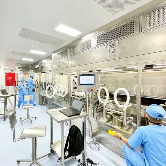 Three persons working in a process technology facility
